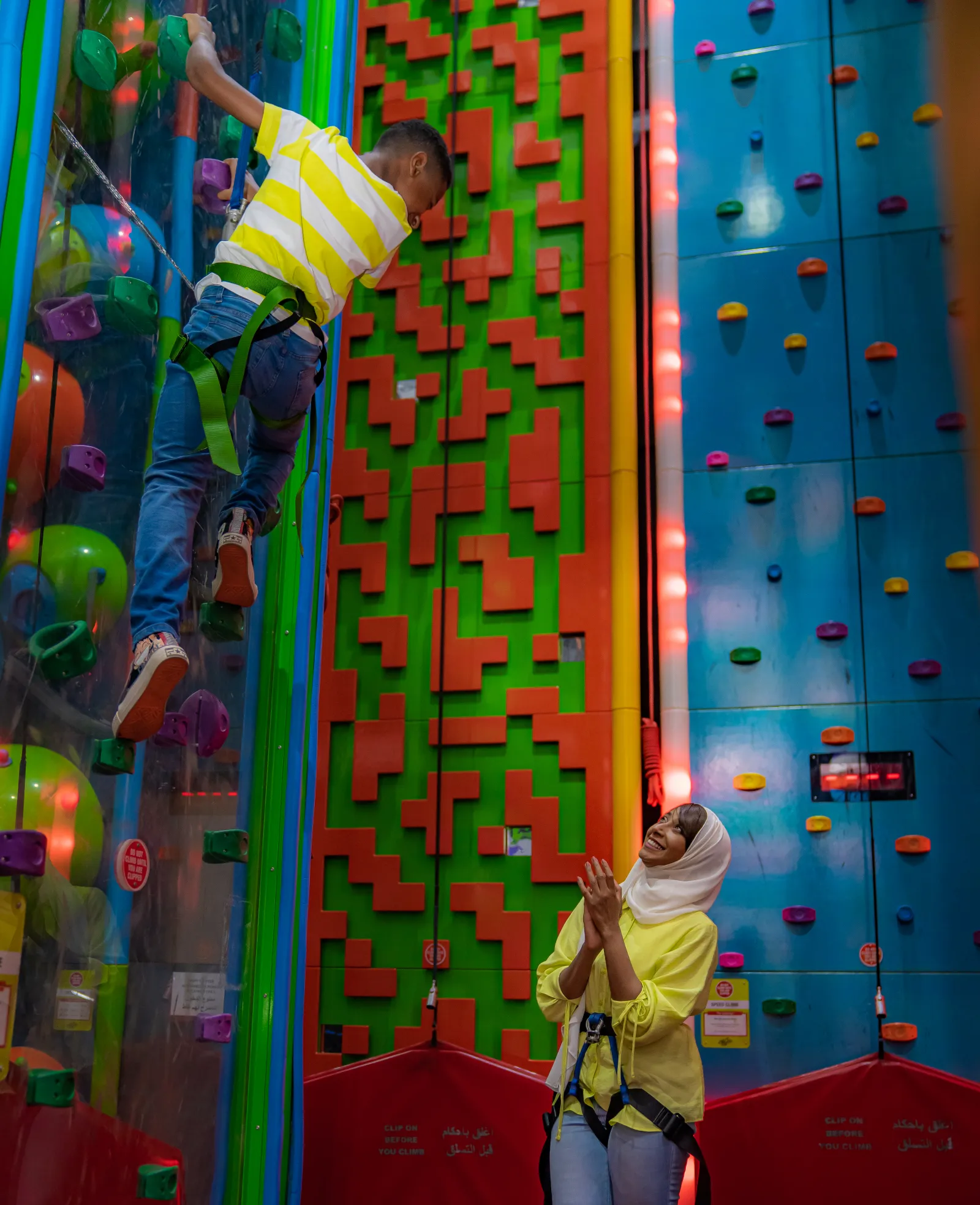 Kids climbing the Trampo climbing wall