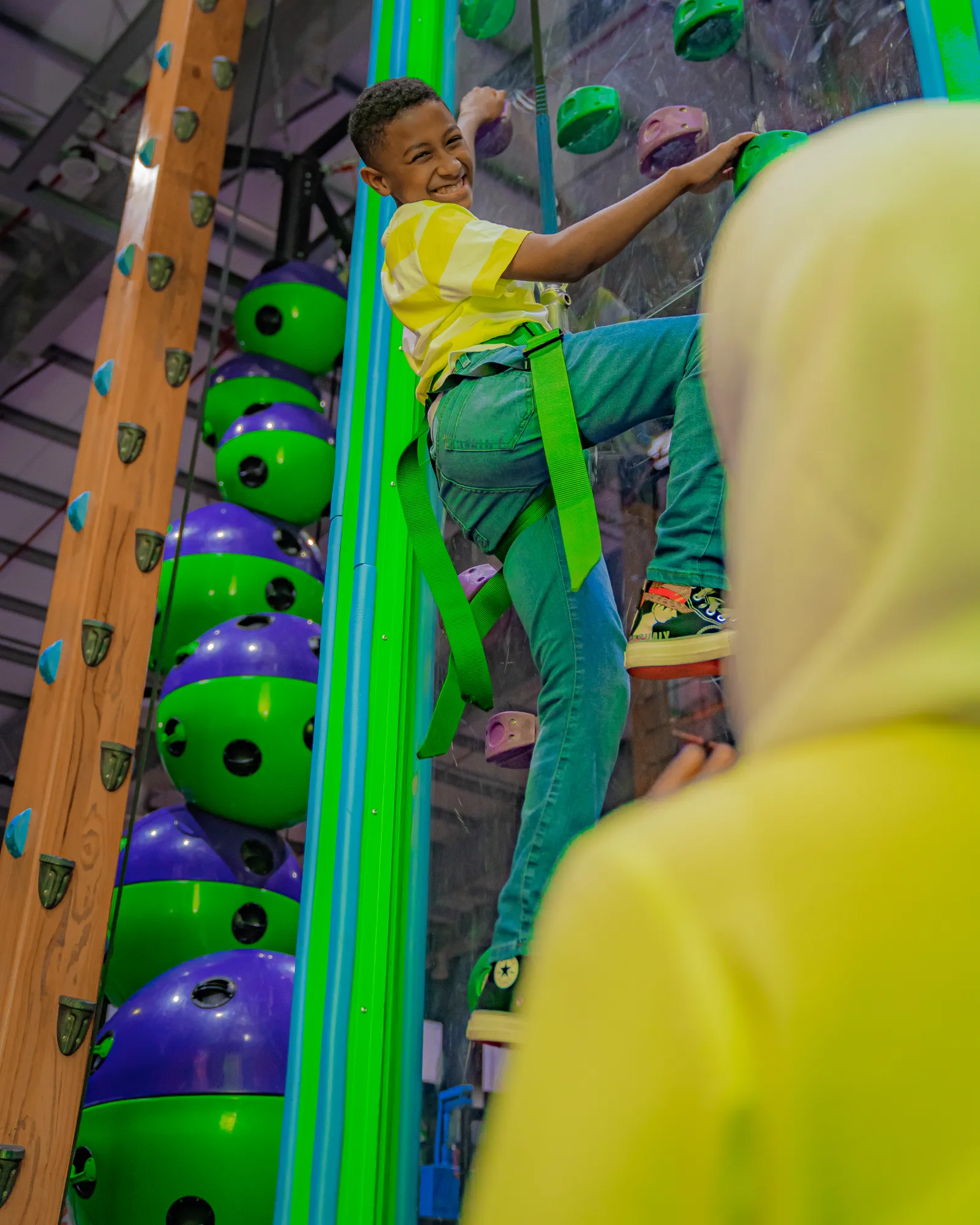 Climbing wall challenge at Trampo Oman