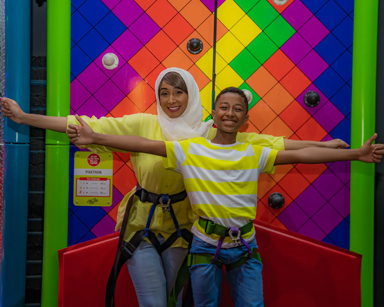 Guest reaching the top of the climbing wall