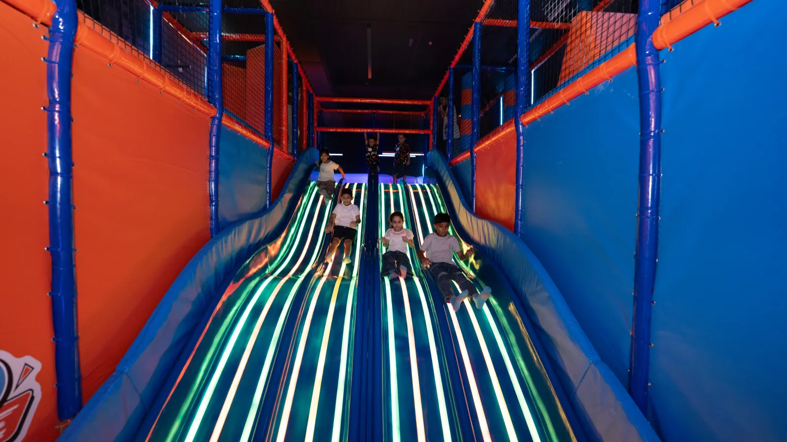 Large indoor slide at Trampo Oman